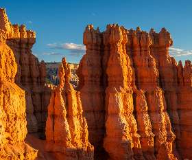 Golden sunrise illuminating hoodoos at Bryce Canyon viewed from Sunrise Point