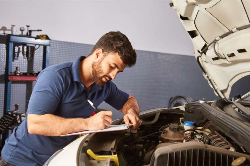 A Man Doing Pre Purchase Car Inspection A Man Doing Pre Purchase Car Inspection