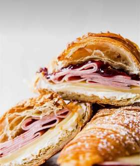 Croissant - cream cheese, smoked ham, Swiss cheese, raspberry jelly. 