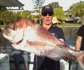  Holding The Fish - True Blue Fishing