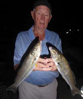 Holding The Fish He Caught- True Blue Fishing