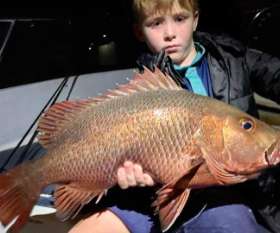  Holding The Fish - True Blue Fishing