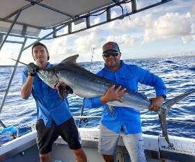  Holding The Fish - True Blue Fishing