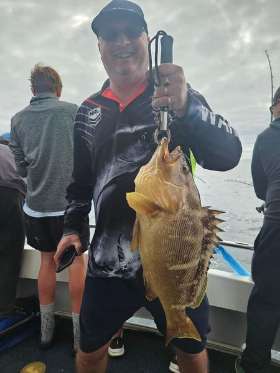 Holding the Fish - True Blue Fishing