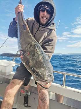 Holding the Fish - True Blue Fishing