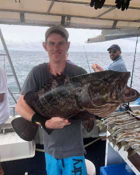 Holding the Fish - True Blue Fishing