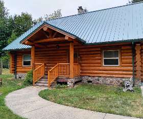 Stunning with its green trim and white garage | Itech Painting Professionals